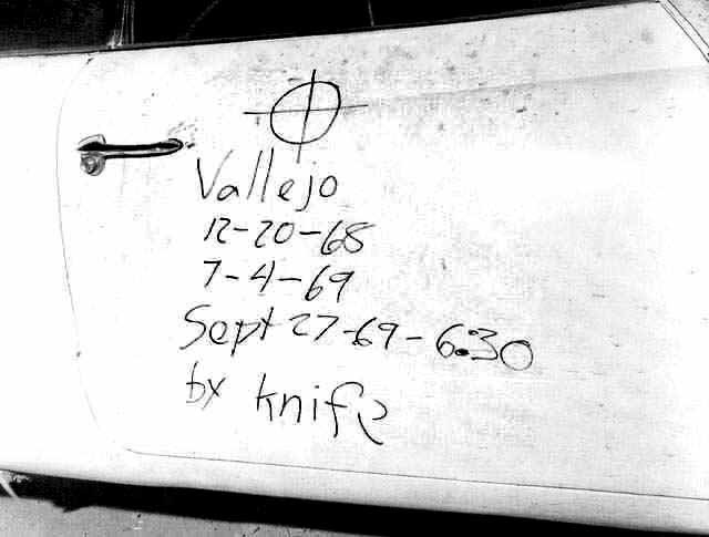 1969 photo of Bryan Hartnell’s car door at Lake Berryessa, with the Zodiac’s handwritten kill list and crosshair symbol in black ink.