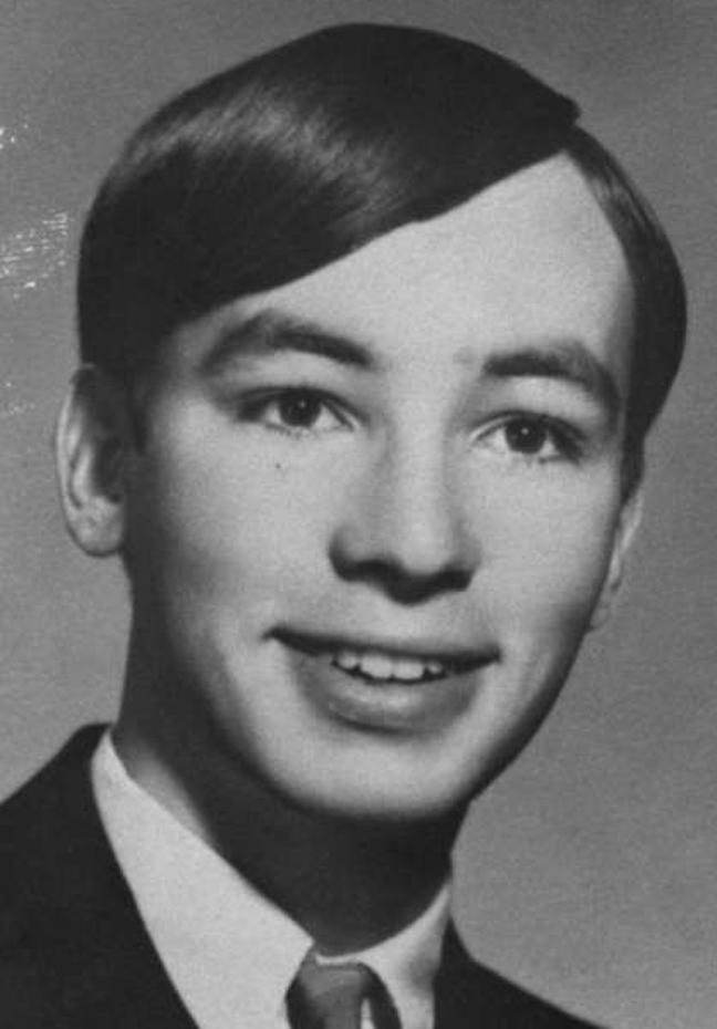 Black and white yearbook photo of David Faraday, a young man in a suit, smiling, representing his life before the Lake Herman Road murder.