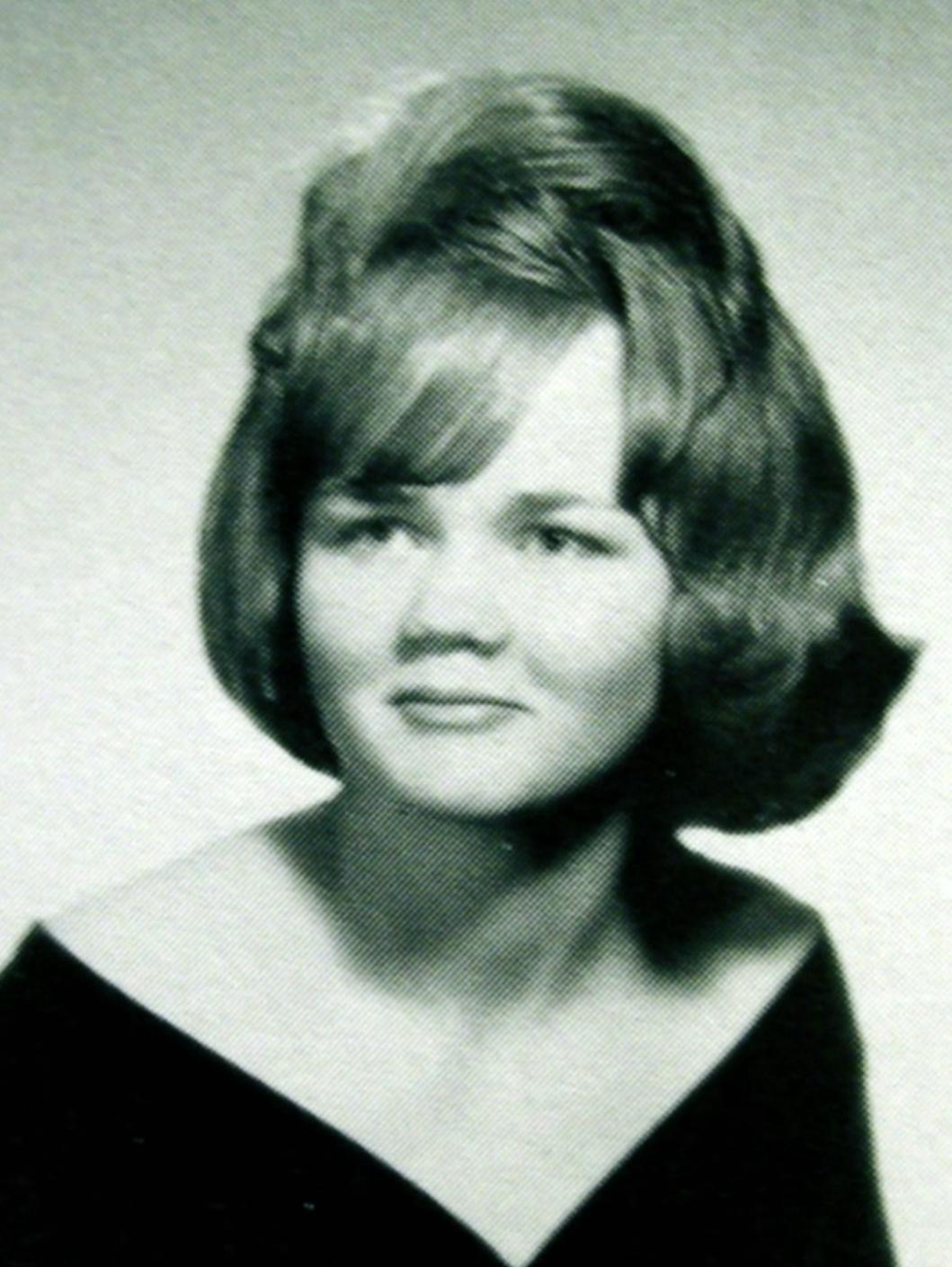 Black-and-white photograph of Darlene Ferrin, a smiling young woman with styled hair, taken around 1969, known as a waitress and mother killed at Blue Rock Springs.