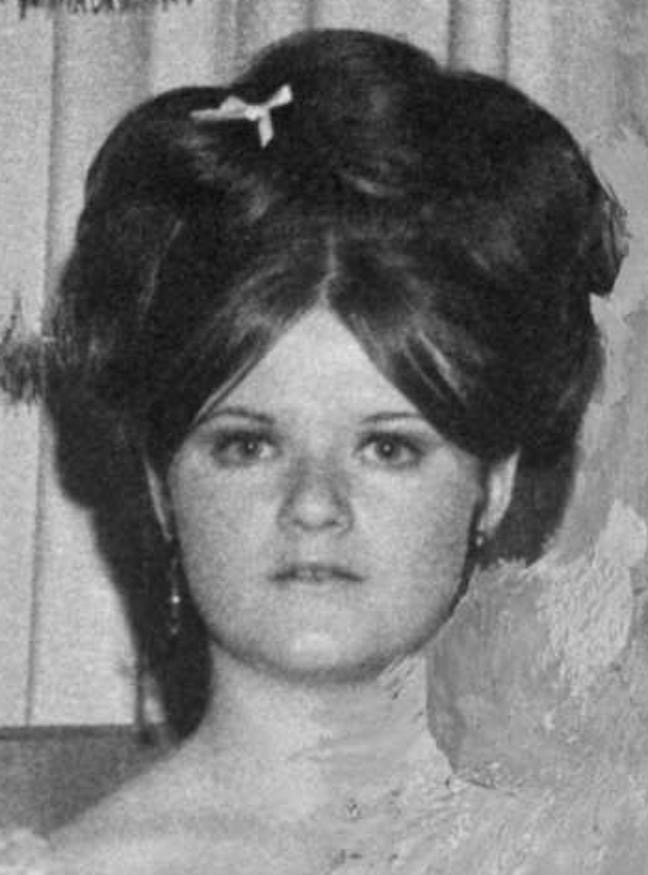 Black and white yearbook photo of Betty Lou Jensen, a young woman in formal dress, smiling, before her death at Lake Herman Road.