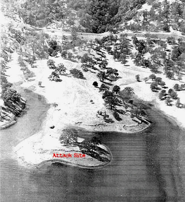 Black-and-white aerial photograph of the Lake Berryessa shoreline with the attack site marked in red.